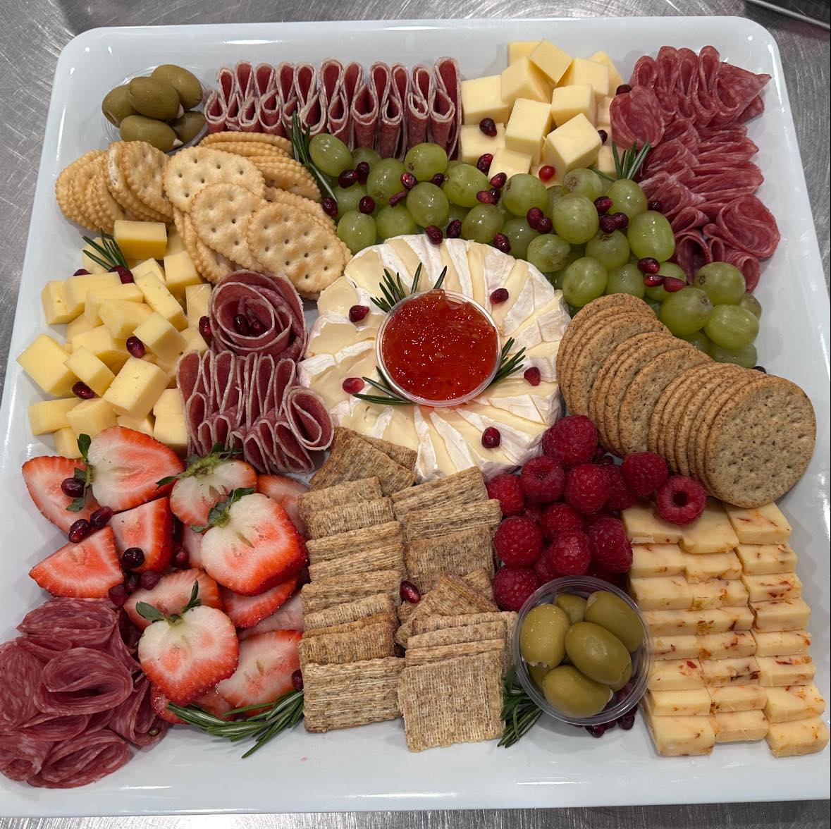 Large charcuterie platter with salami rose